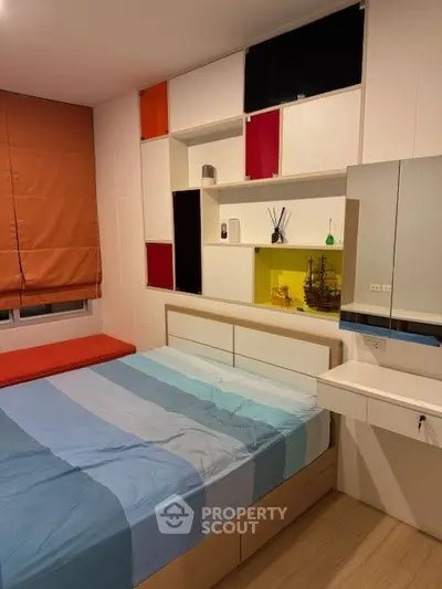 Modern bedroom with colorful shelving and stylish decor