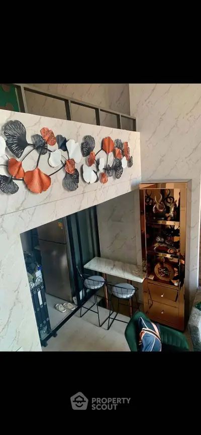 Stylish modern living room with artistic wall decor and elegant furniture