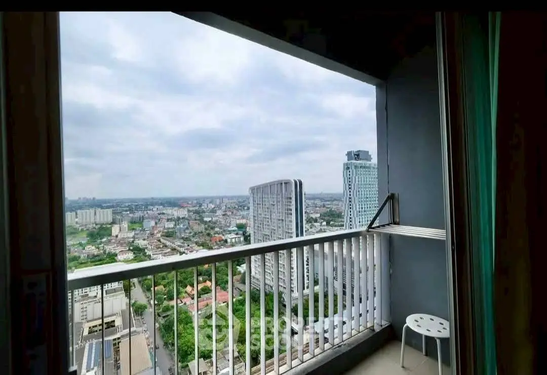Stunning cityscape view from high-rise balcony with expansive skyline.