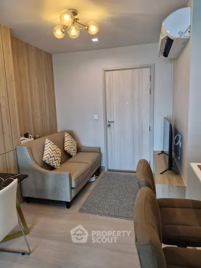 Modern living room with stylish furniture and air conditioning, perfect for cozy urban living.