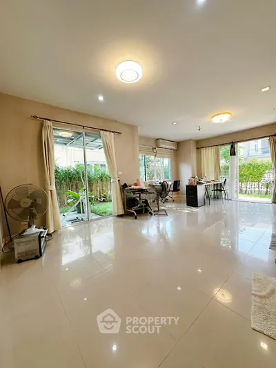 Spacious living room with garden view and modern decor