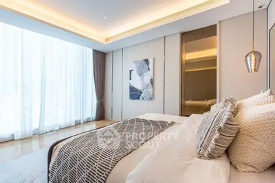 Luxurious modern bedroom with elegant decor and large window