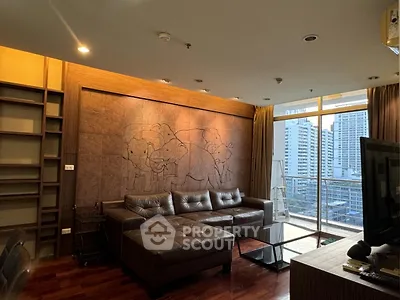 Luxurious living room with modern decor and city view balcony