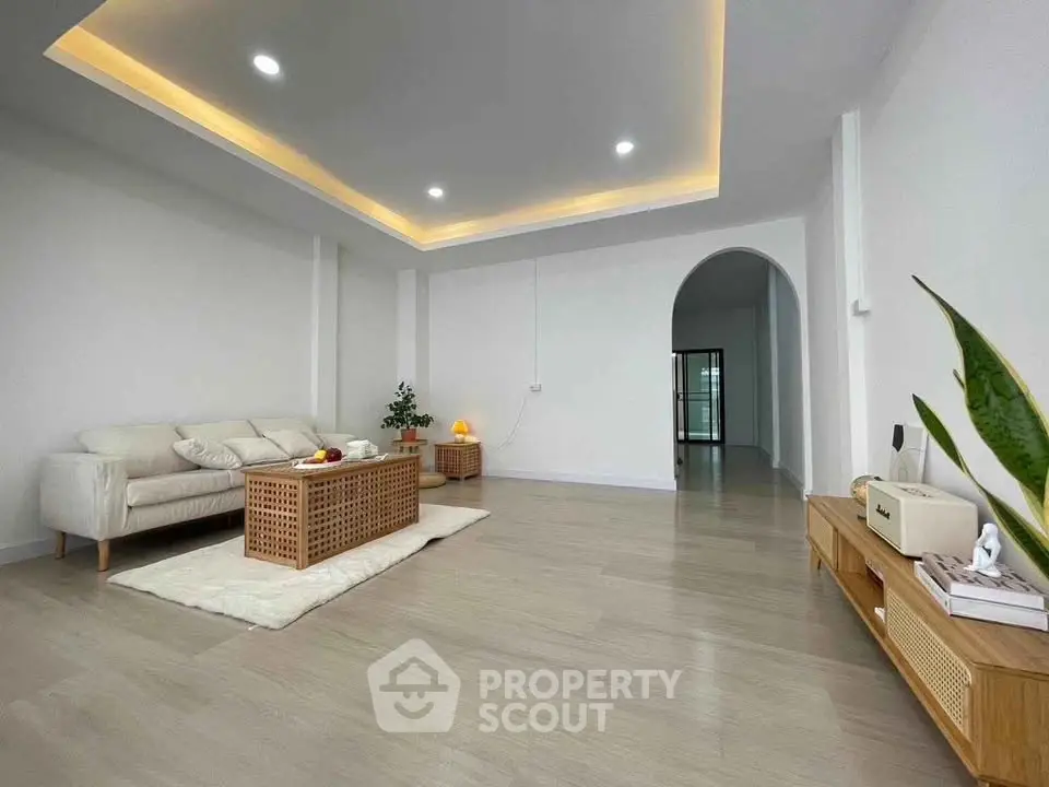 Spacious modern living room with elegant lighting and cozy furniture