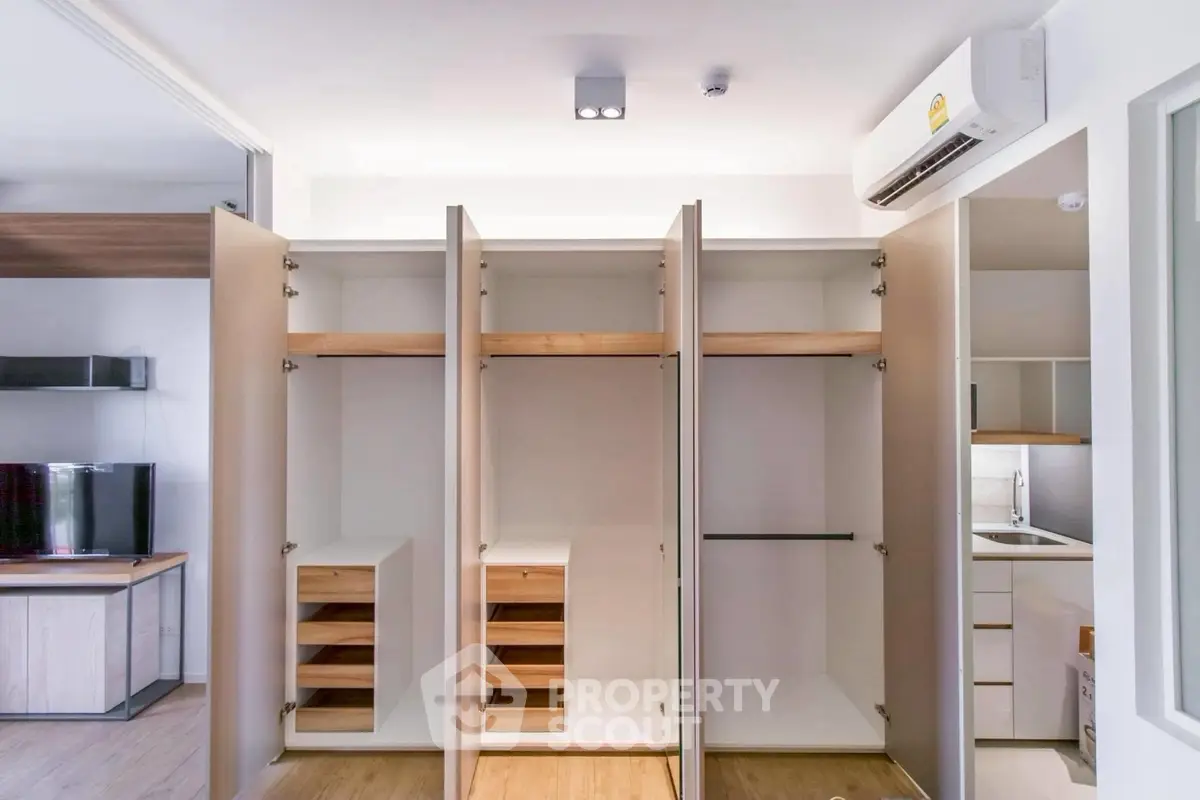 Spacious modern closet with open doors in a stylish apartment interior