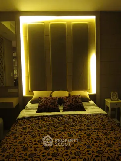 Luxurious bedroom with elegant lighting and stylish decor, perfect for a cozy and sophisticated living experience.