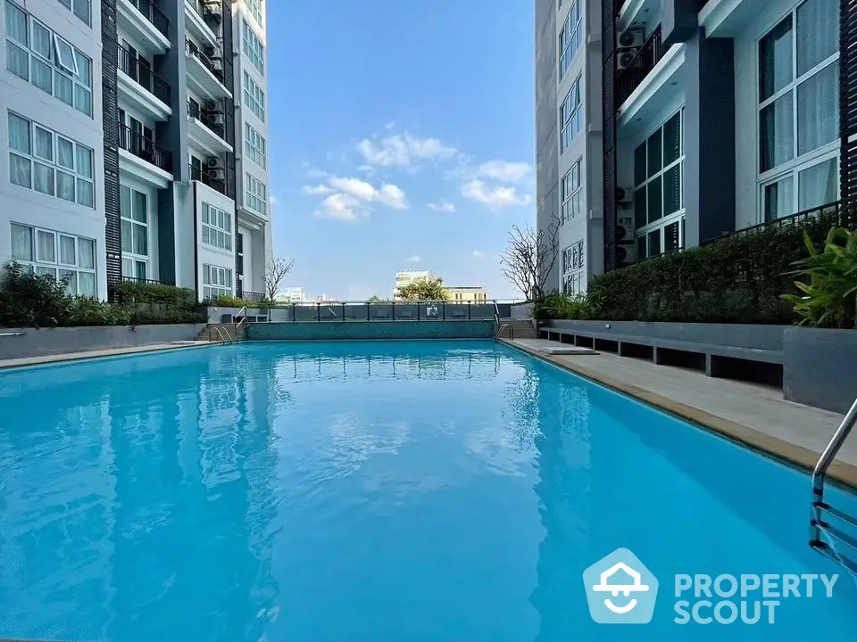 Luxury condominium with stunning outdoor pool and modern architecture