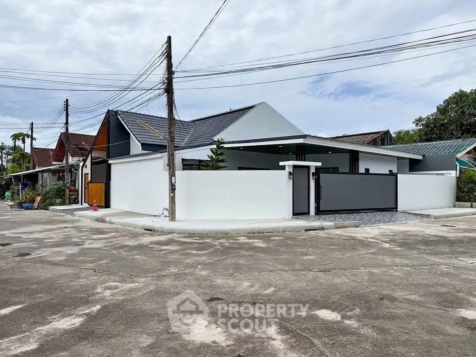 Modern corner unit house with sleek design and spacious driveway