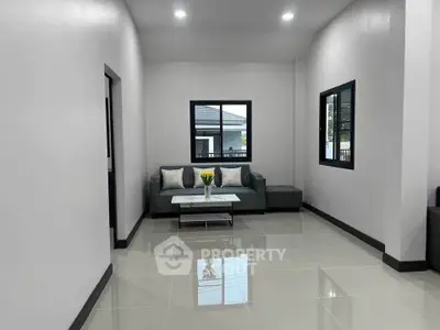 Modern living room with sleek design and cozy seating area