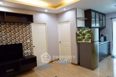 Modern living room with stylish decor and open kitchen layout