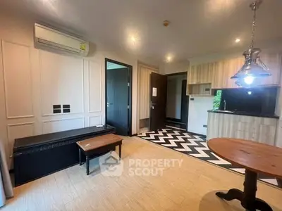 Modern living room with open kitchen and stylish lighting