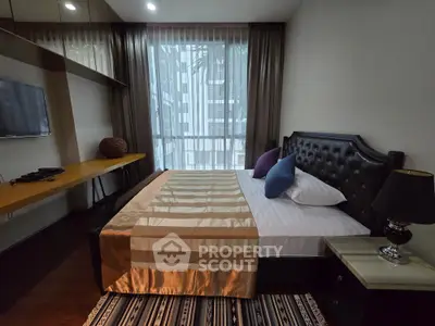 Luxurious bedroom with modern decor and large window view