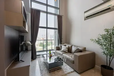 Luxurious high-rise living room with stunning city view and modern decor