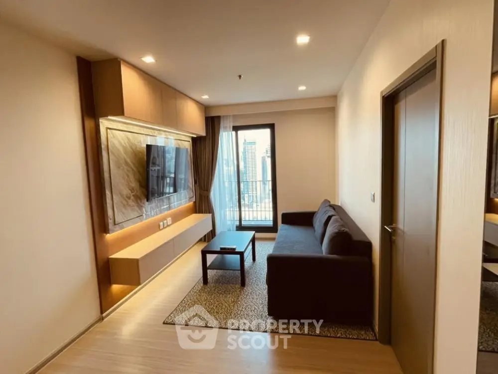 Modern living room with sleek design and city view, featuring a comfortable sofa and wall-mounted TV.