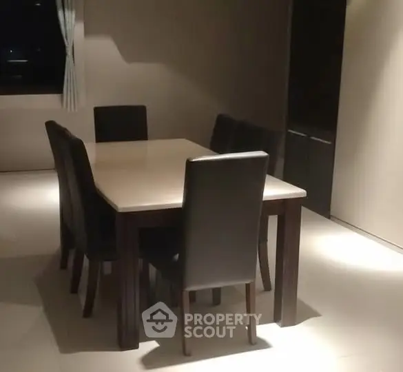 Elegant dining area with modern table and chairs, perfect for stylish gatherings.