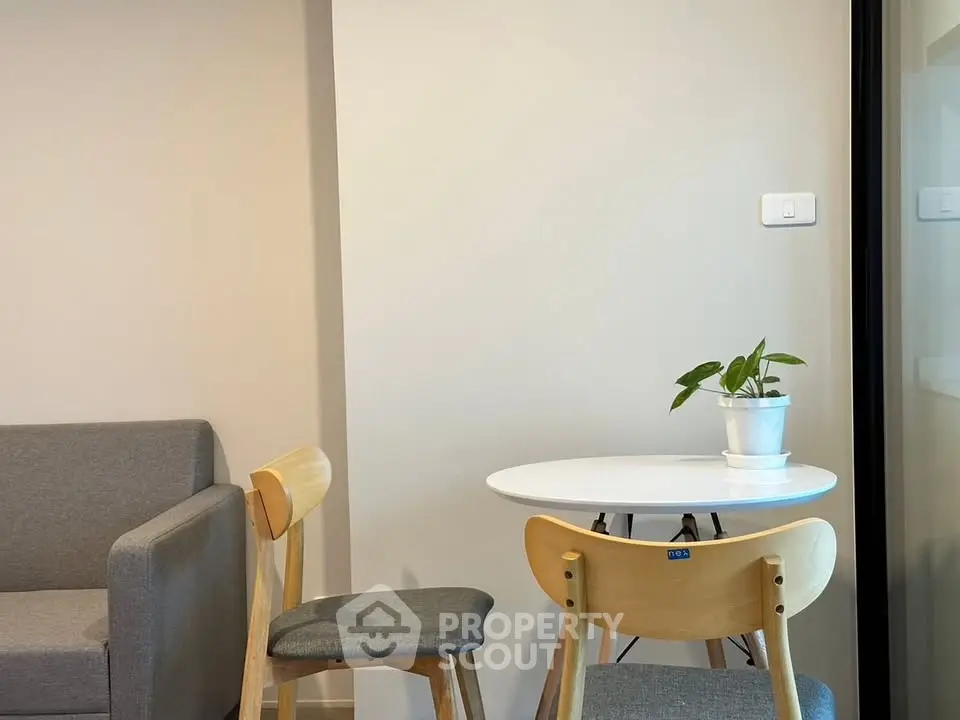 Modern living room with cozy seating and stylish table, perfect for relaxation and entertaining.