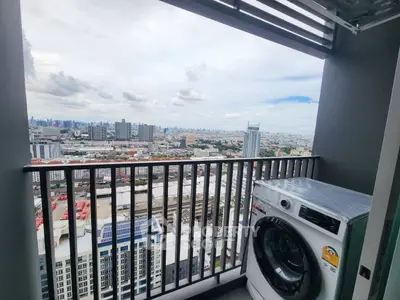 Stunning high-rise balcony with cityscape view and modern washing machine.