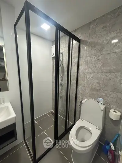 Modern bathroom with sleek shower enclosure and contemporary fixtures