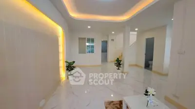 Spacious modern living room with elegant lighting and marble flooring