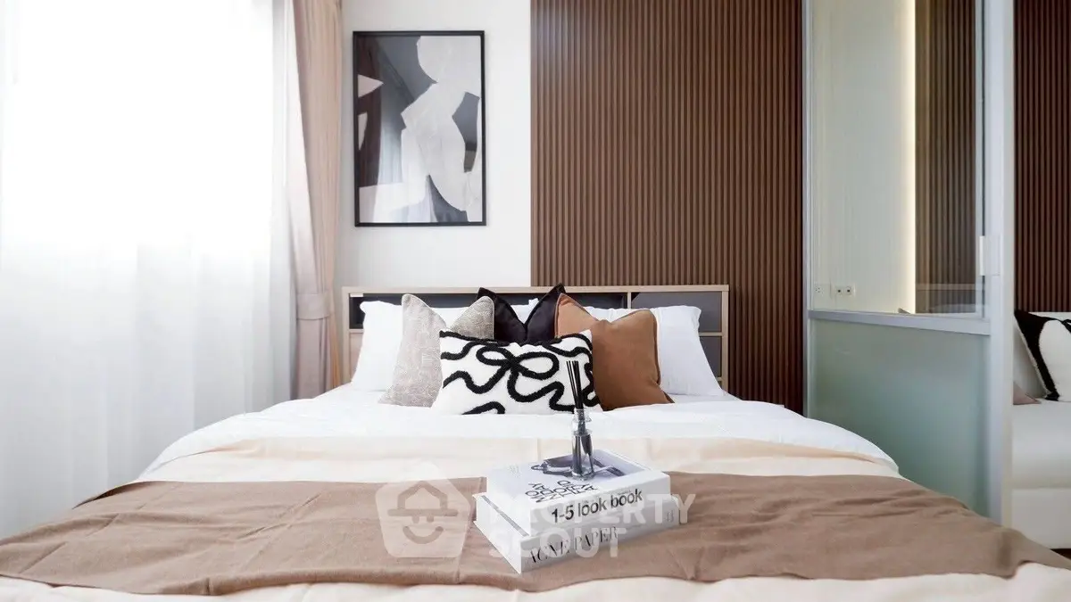 Stylish bedroom with modern decor and cozy bedding