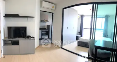 Modern apartment interior with open layout, featuring a cozy living area, sleek kitchen, and bright bedroom.