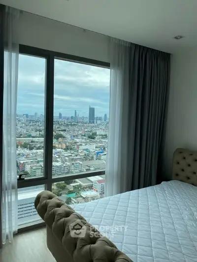 Luxurious bedroom with stunning city view from large windows, featuring elegant decor and plush bedding.