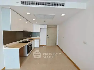 Modern kitchen with sleek cabinetry and built-in appliances in a minimalist design.