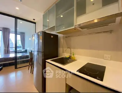 Modern kitchen with sleek appliances and open layout in a stylish apartment