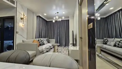 Luxurious modern living room with elegant decor and plush seating in a stylish apartment.