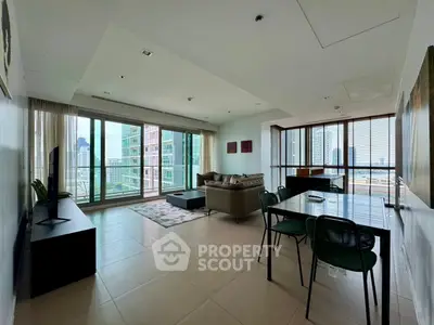 Spacious modern living room with city view and elegant furnishings