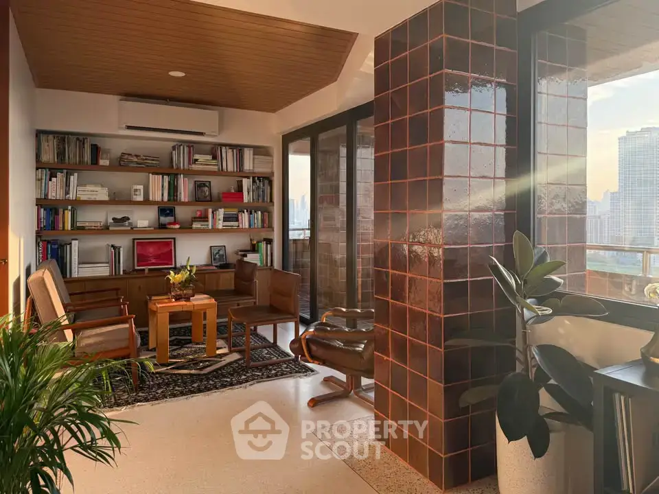 Stylish living room with city view, featuring modern furniture and a cozy reading nook.