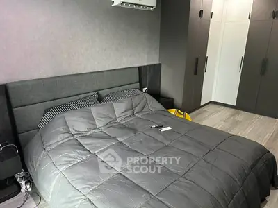 Modern bedroom with sleek design and ample storage space