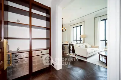 Luxurious living room with elegant decor and large windows offering natural light.