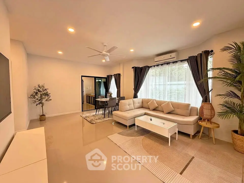 Spacious modern living room with elegant decor and natural light