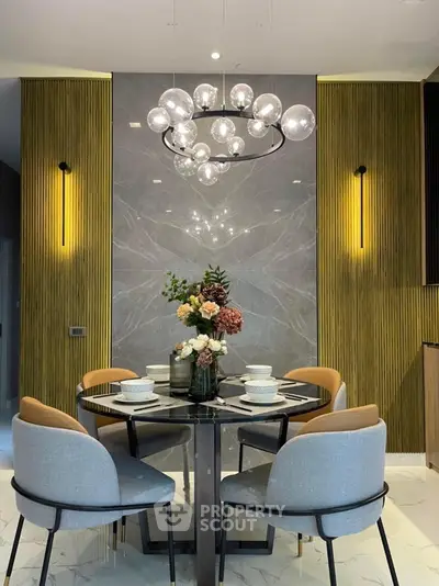 Elegant dining area with modern chandelier and stylish decor