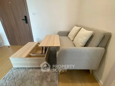 Modern living room with stylish sofa and multifunctional coffee table in cozy apartment.