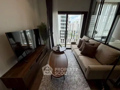 Stylish living room with modern furniture and city view balcony in high-rise apartment.