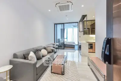 Modern open-plan living room with sleek design and cozy ambiance