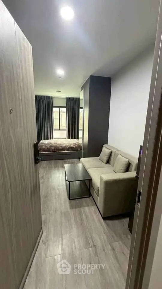 Modern studio apartment with cozy living area and stylish bedroom, perfect for urban living.