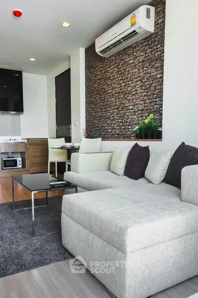 Modern living room with stylish decor and comfortable seating in a contemporary apartment.