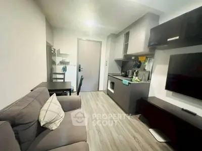 Modern living room with sleek furniture and open kitchen layout