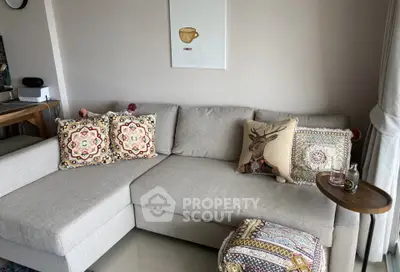 Cozy living room with stylish L-shaped sofa and decorative cushions