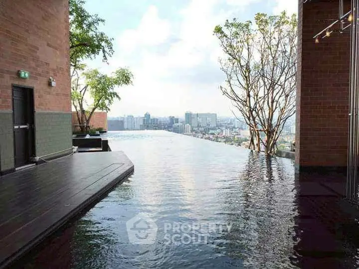 Stunning rooftop infinity pool with breathtaking city skyline view
