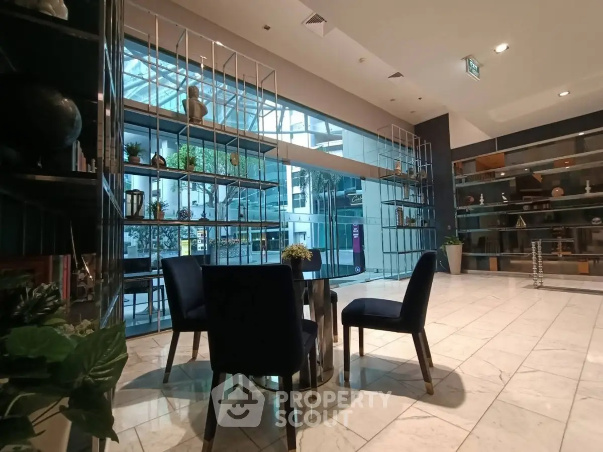 Elegant lobby with modern decor and seating area in a luxurious building