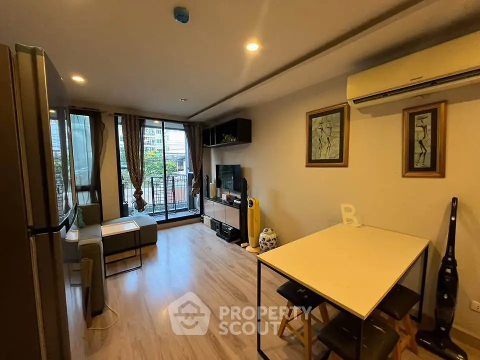 Modern living room with balcony view and stylish decor in urban apartment