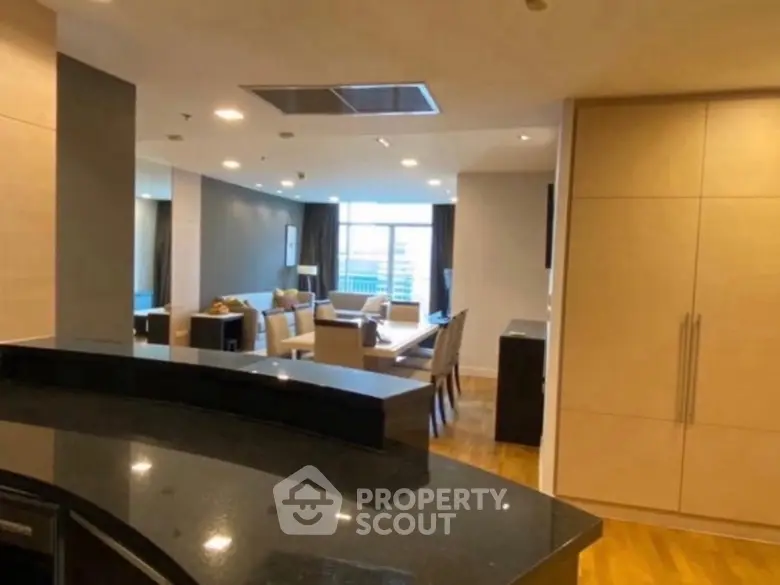 Spacious modern living room with open layout and elegant furnishings.