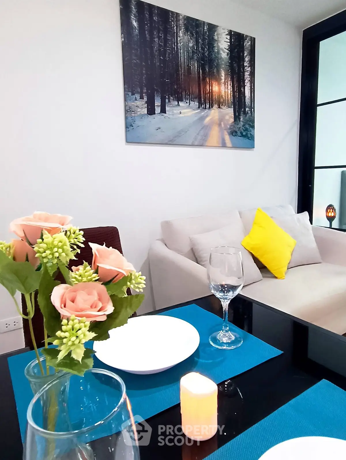 Chic modern living room with elegant dining setup and cozy sofa, perfect for stylish urban living.