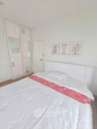 Bright and cozy bedroom with modern decor and ample storage space.