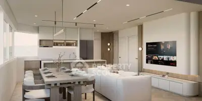 Modern open-plan living room and kitchen with sleek design and natural light.