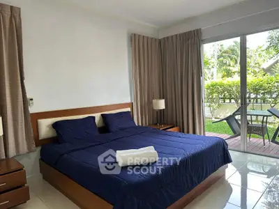 Spacious bedroom with garden view and modern furnishings